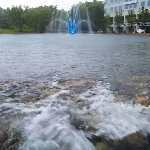 pond with fountain and streams of water